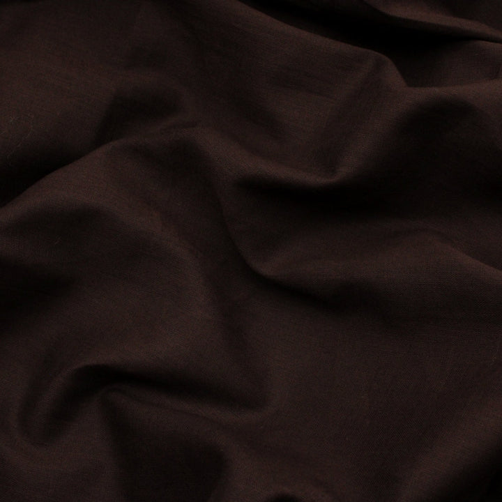 Close-up of dark brown rubia voile turban with folds