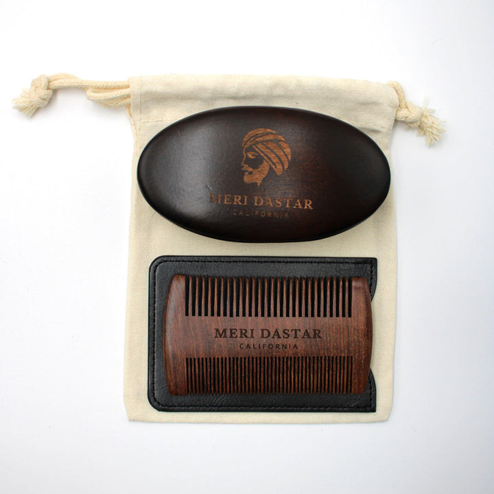 Beard grooming set with black oval brush and brown comb in a drawstring bag on a white background Meri Dastar