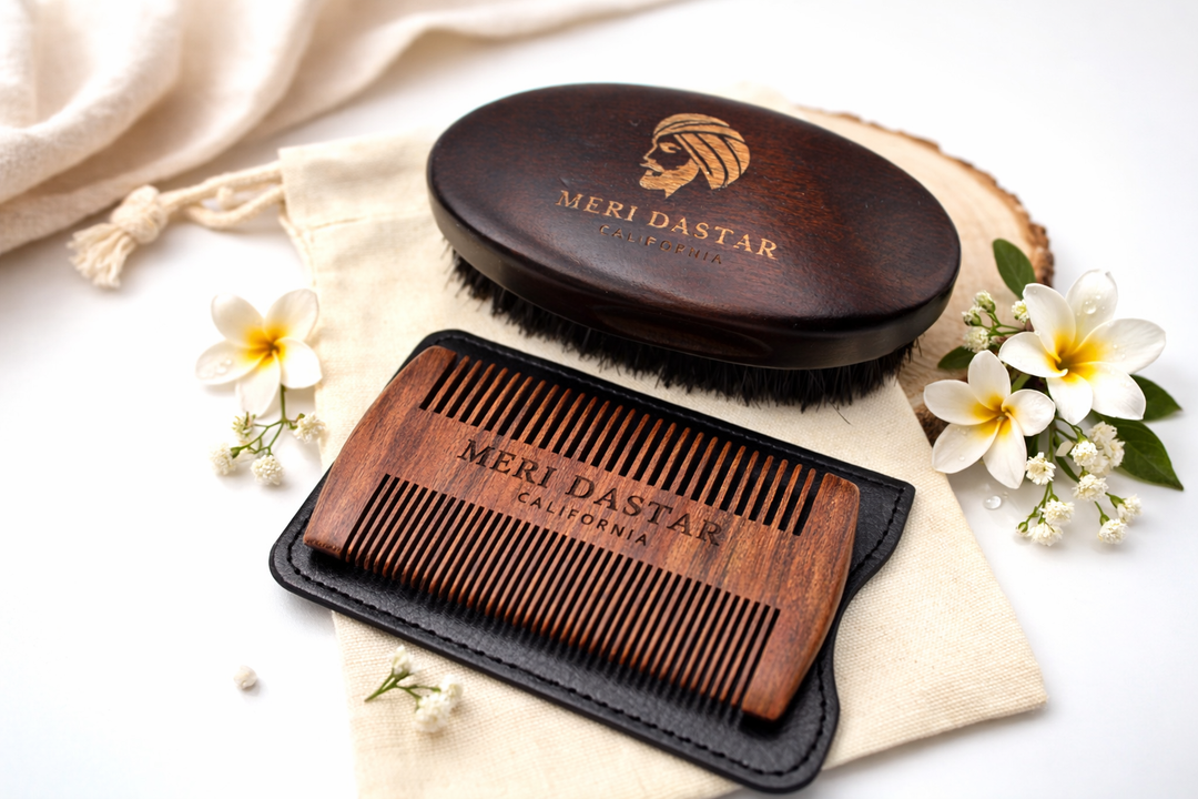 Brown leather case and black bristle brush on a white background